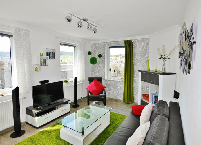 Fewo-Penthausblick**** - Wohnzimmer mit Homecinema und guter CD/DVD-Auswahl