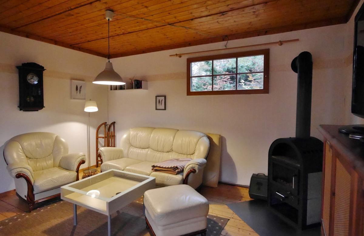 Haus Schönblick - Wohnbereich mit Ofen